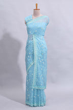 Blue floral design chamki work designer saree with self scallop border and matching blouse