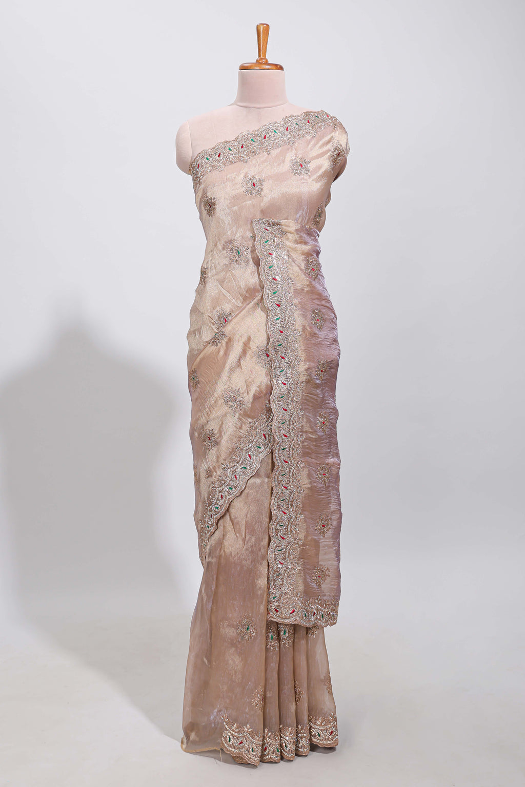 Beige floral designed tissue silk designer saree with self scallop border and matching blouse