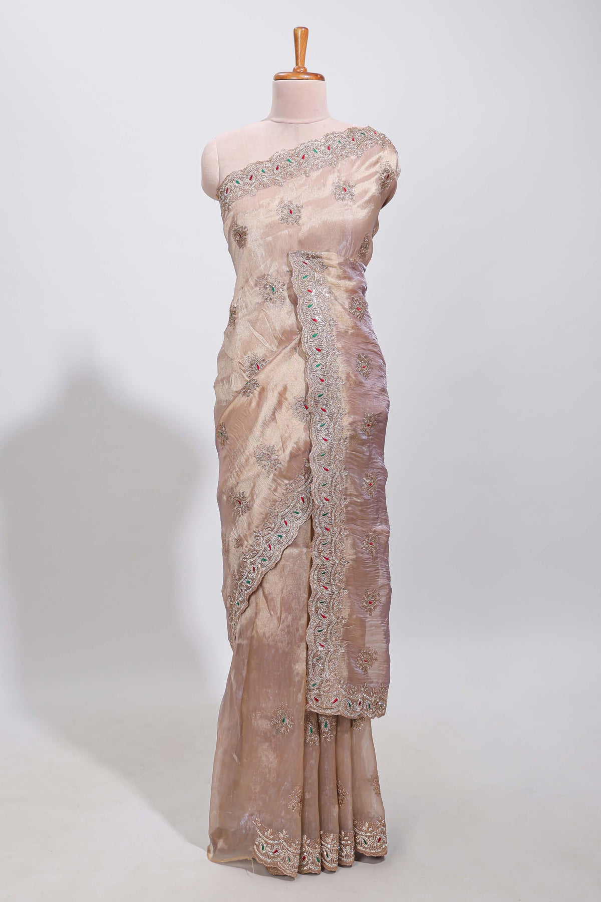 Beige floral designed tissue silk designer saree with self scallop border and matching blouse