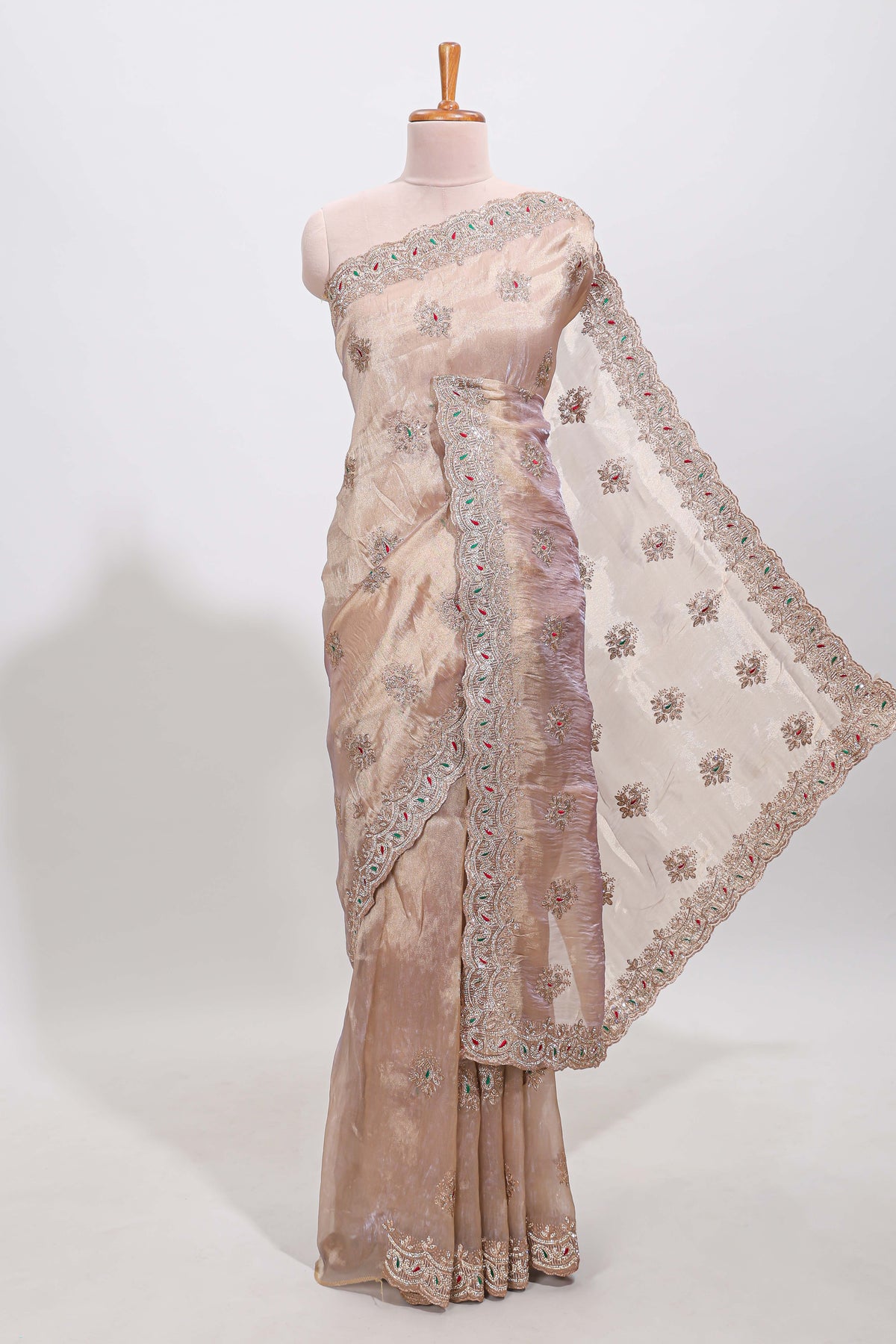Beige floral designed tissue silk designer saree with self scallop border and matching blouse