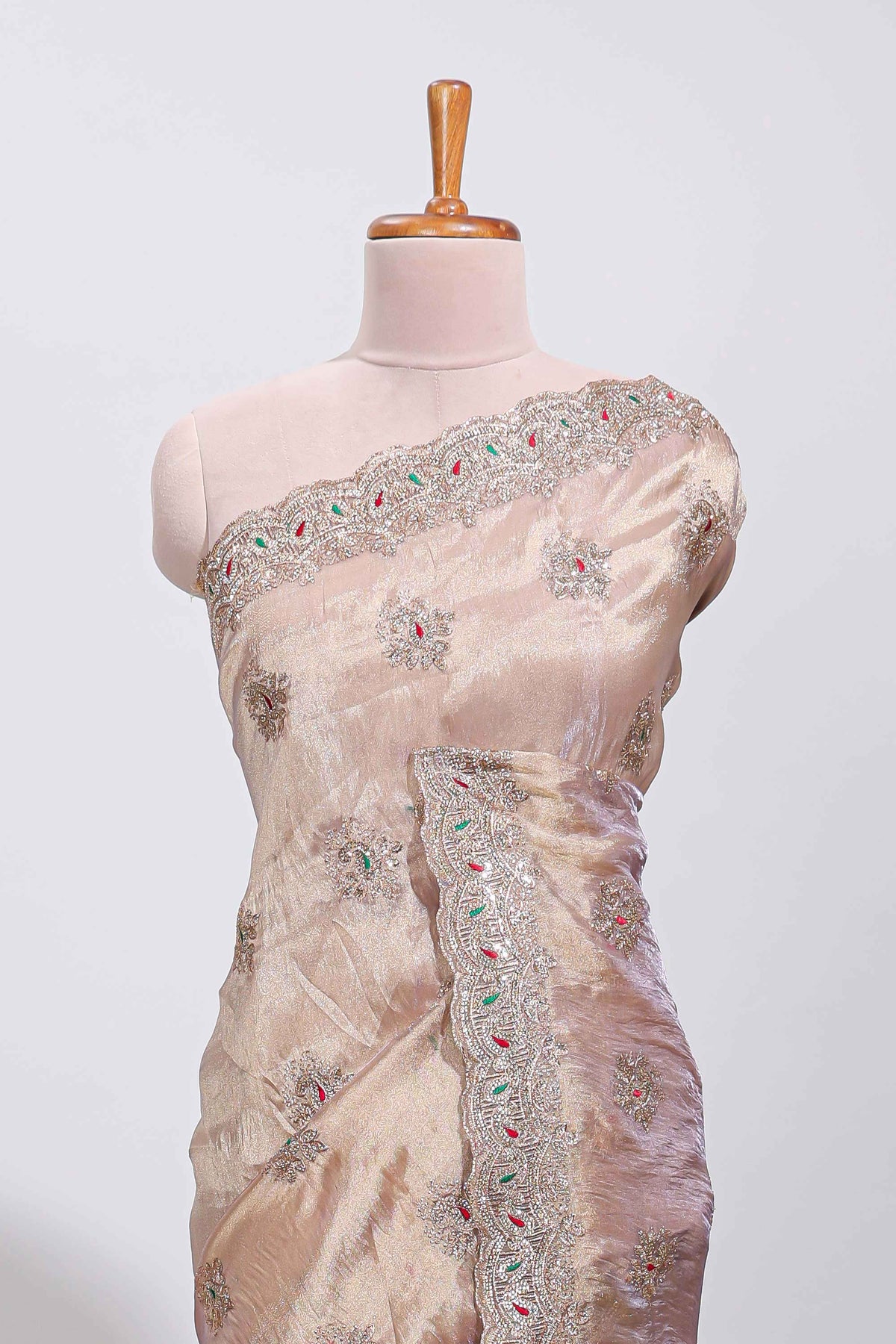 Beige floral designed tissue silk designer saree with self scallop border and matching blouse