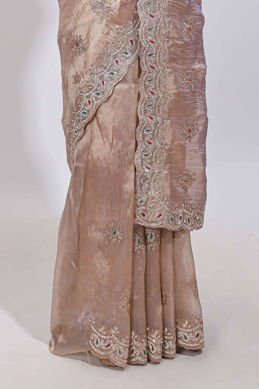 Beige floral designed tissue silk designer saree with self scallop border and matching blouse