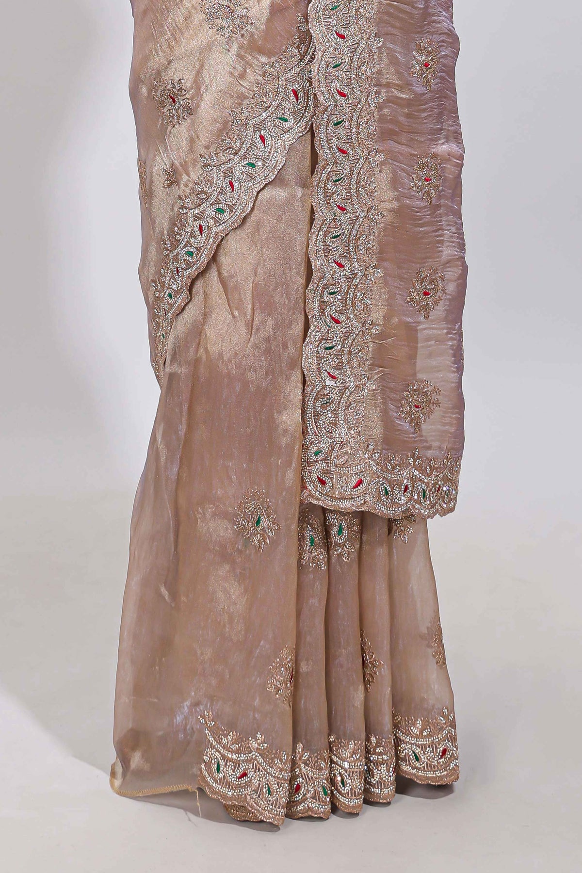 Beige floral designed tissue silk designer saree with self scallop border and matching blouse