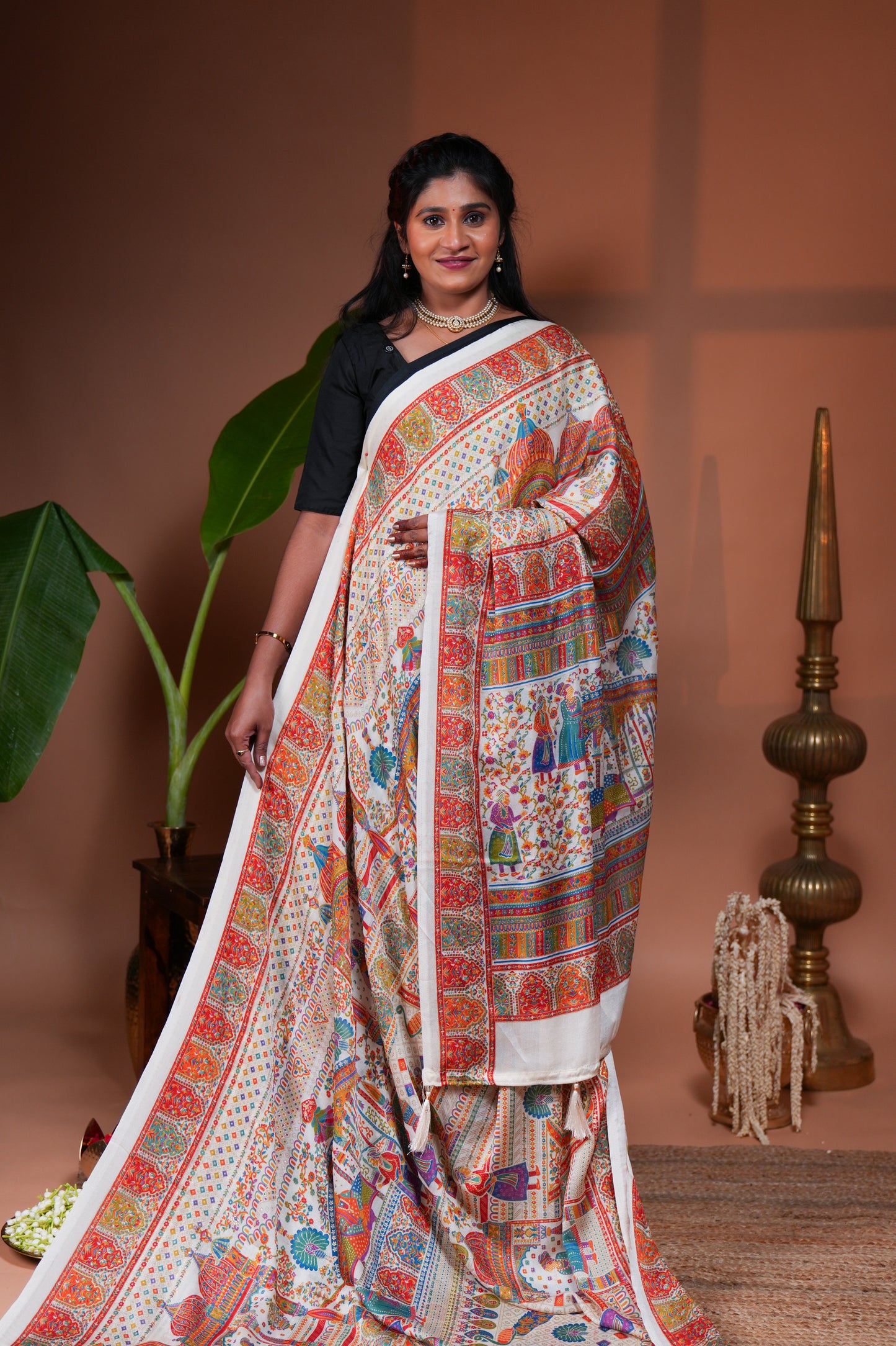 Cream mughal style foil print georgette saree with self border and matching floral printed blouse