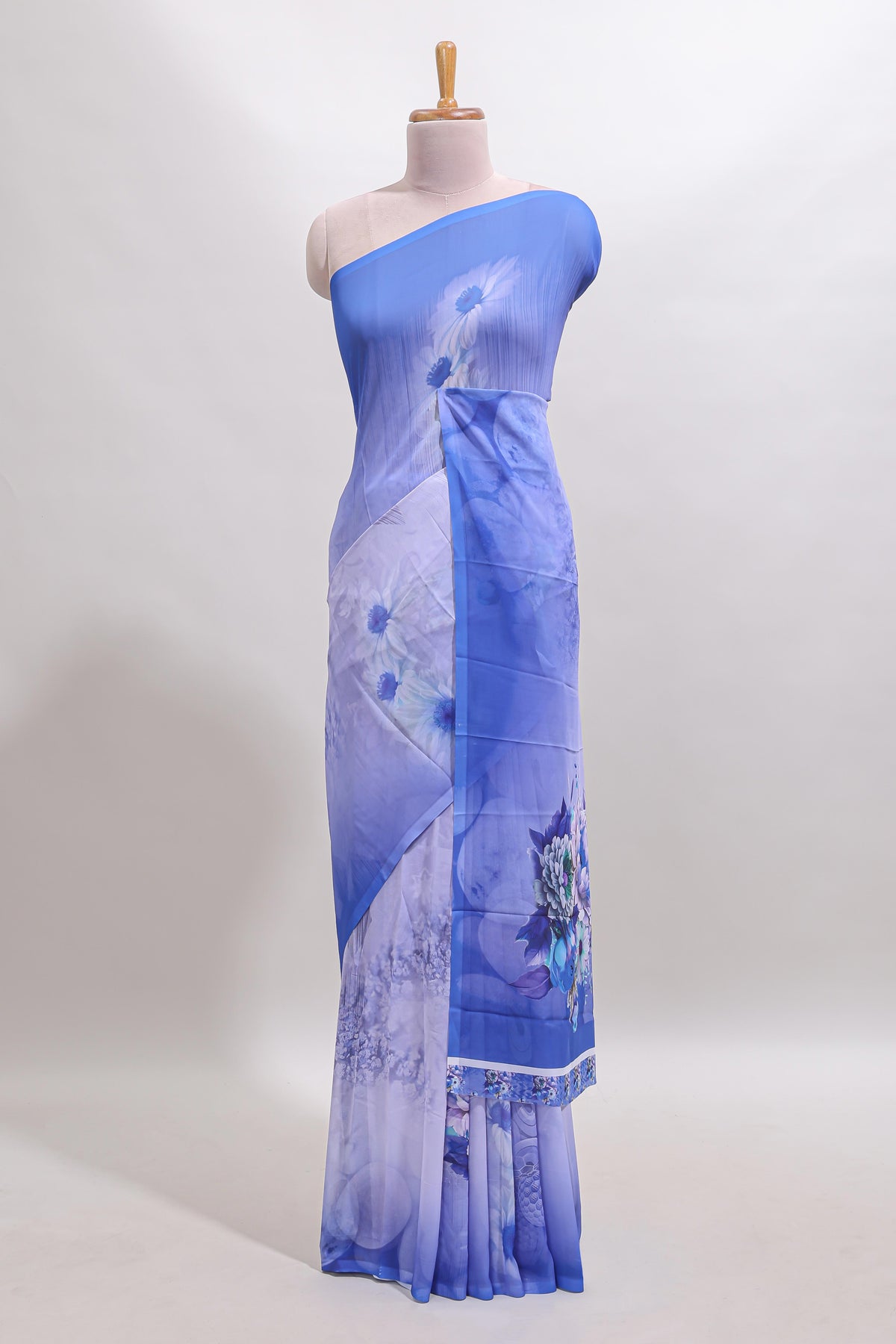 Buy Borderless blue floral design georgette saree with matching printed blouse