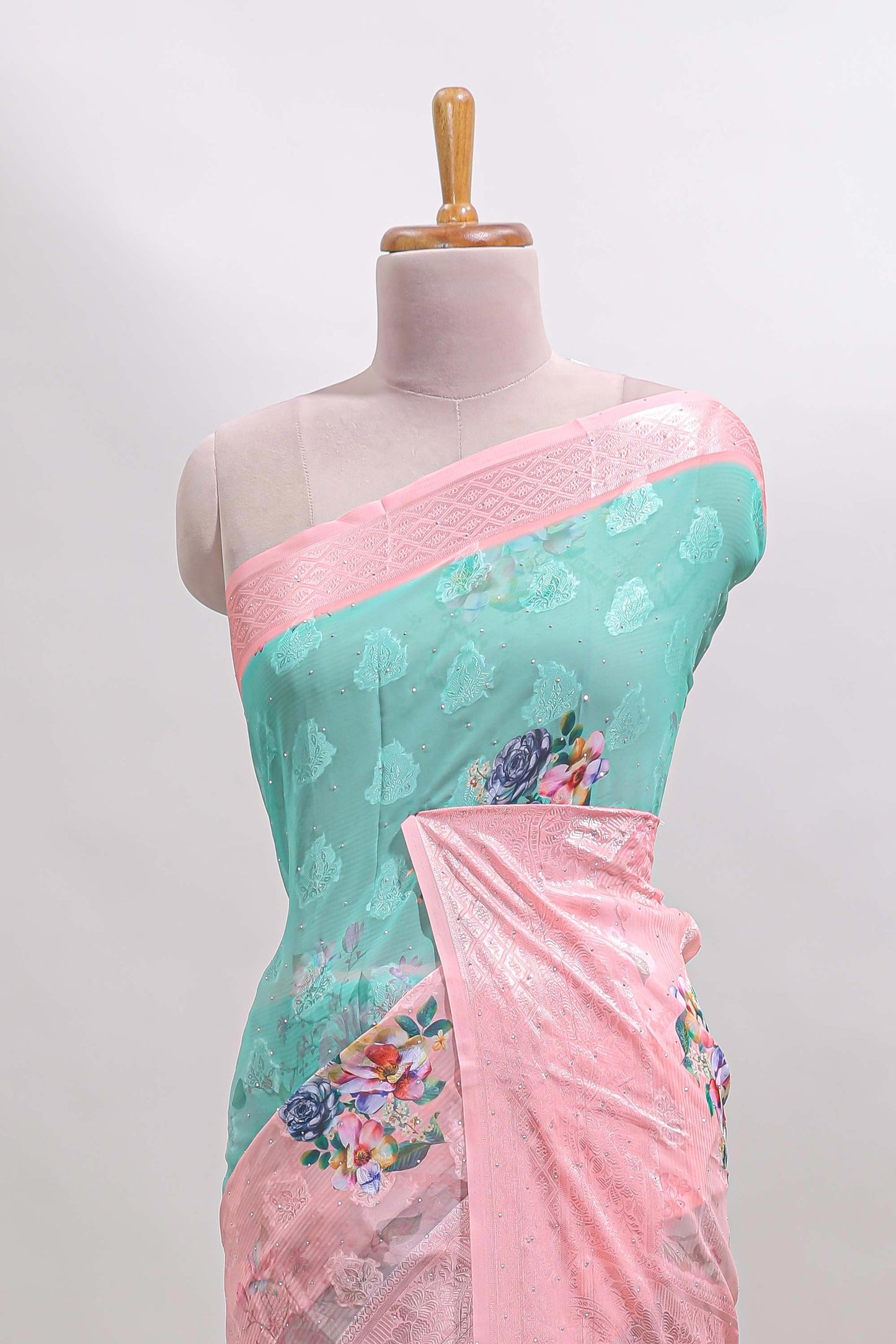 urquiose green and pink dual shade floral design georgette saree with contrast zari border and blouse