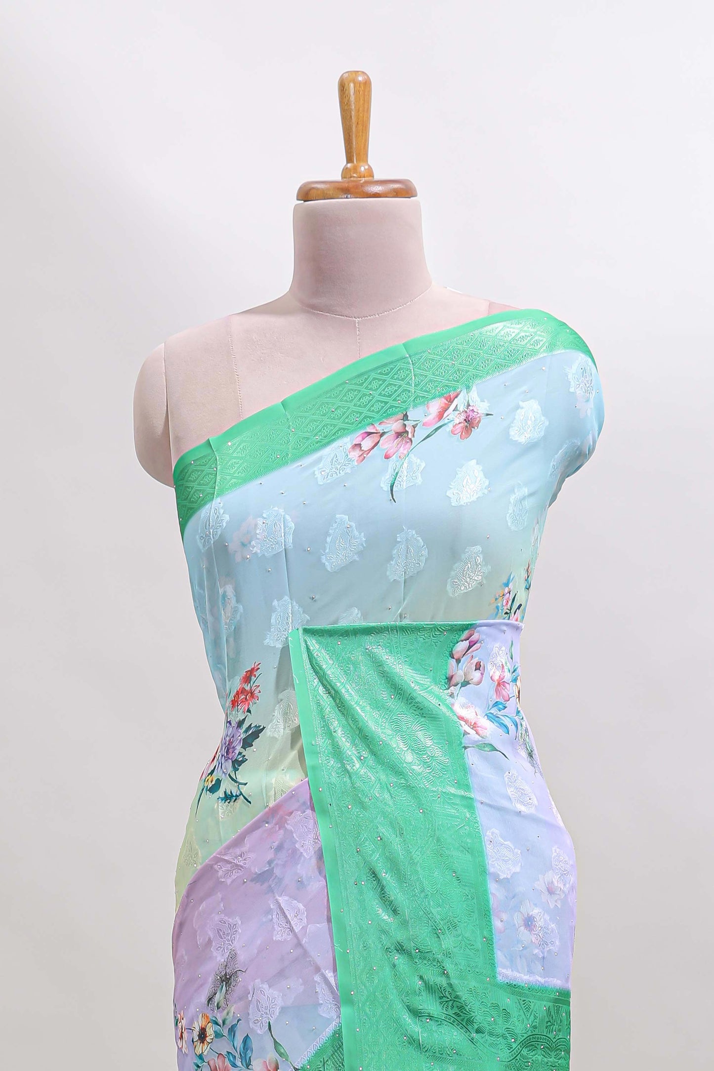 Multi color floral design georgette saree with contrast zari border and blouse