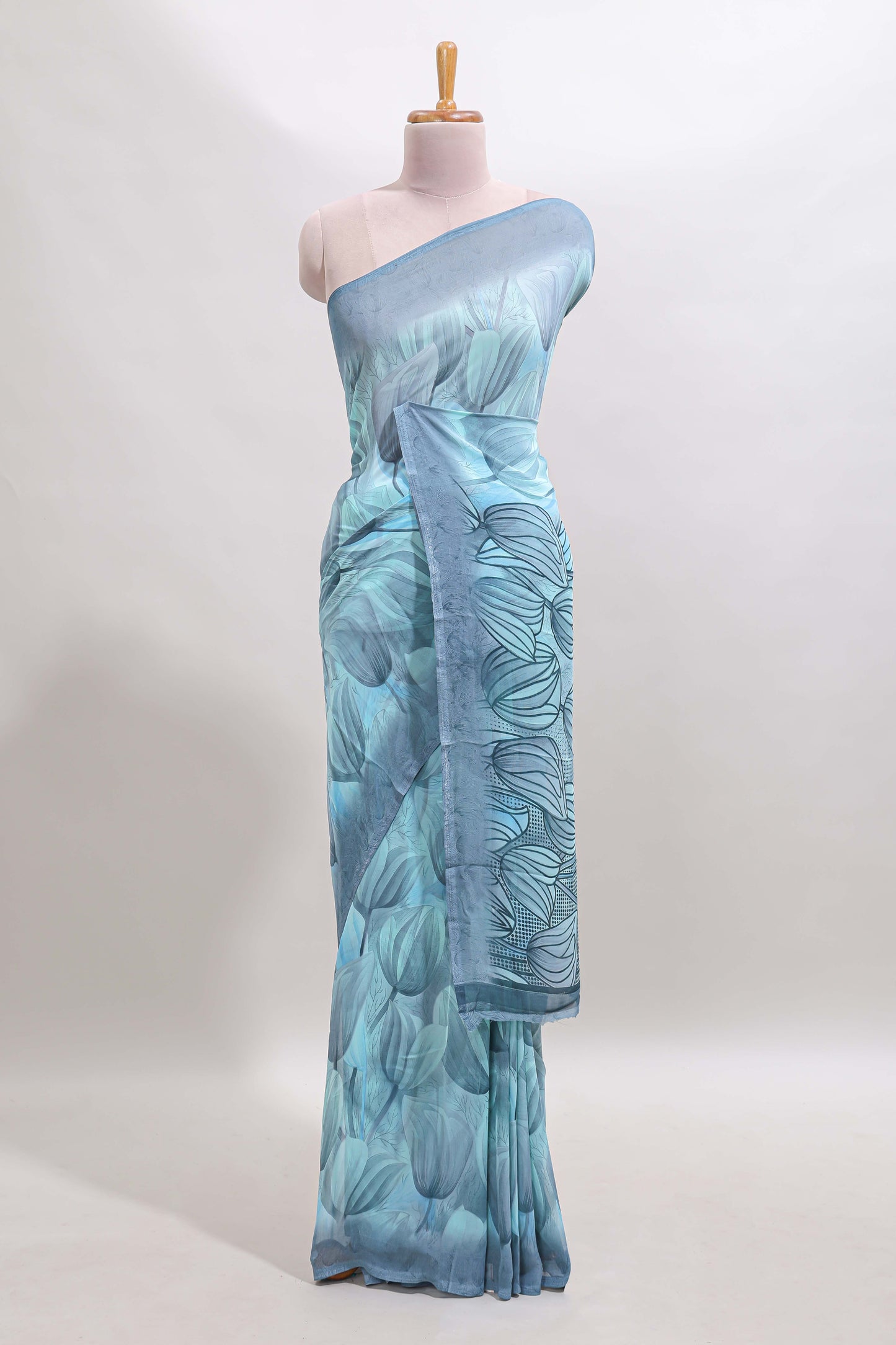 Blue floral design georgette saree with self border and matching blouse