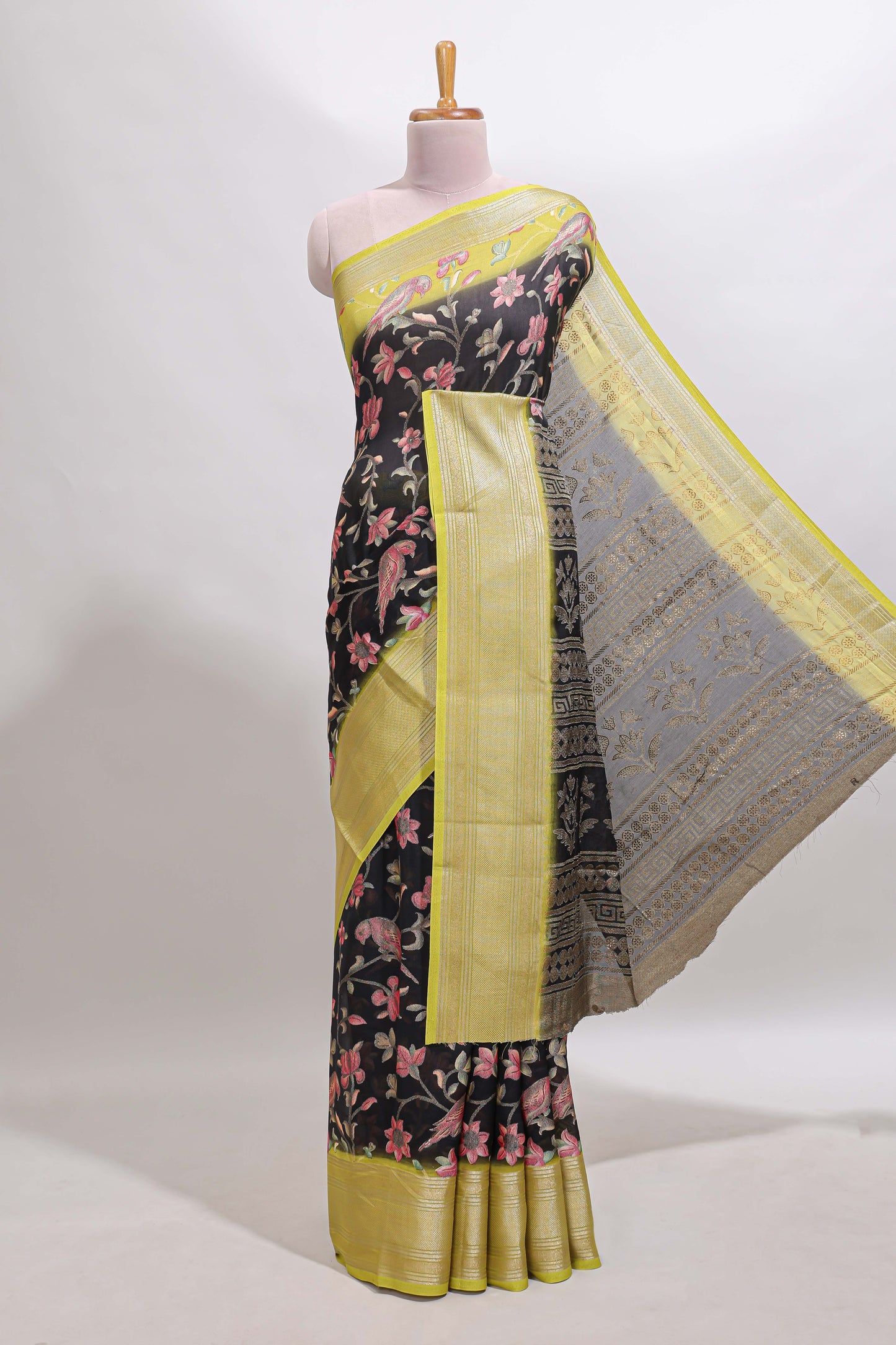 Black floral design georgette saree with contrast border and motifs blouse