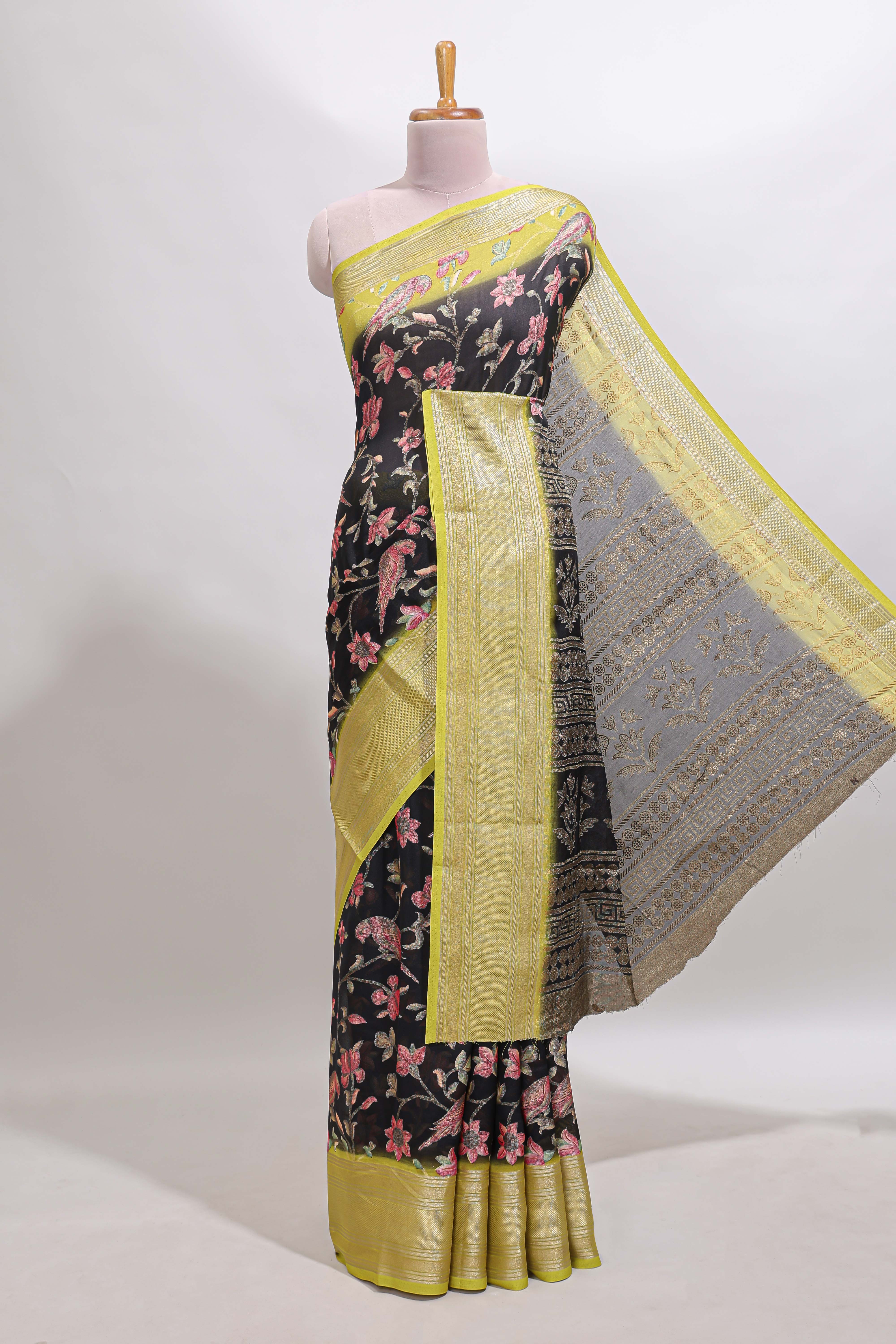Black floral design georgette saree with contrast border and motifs blouse