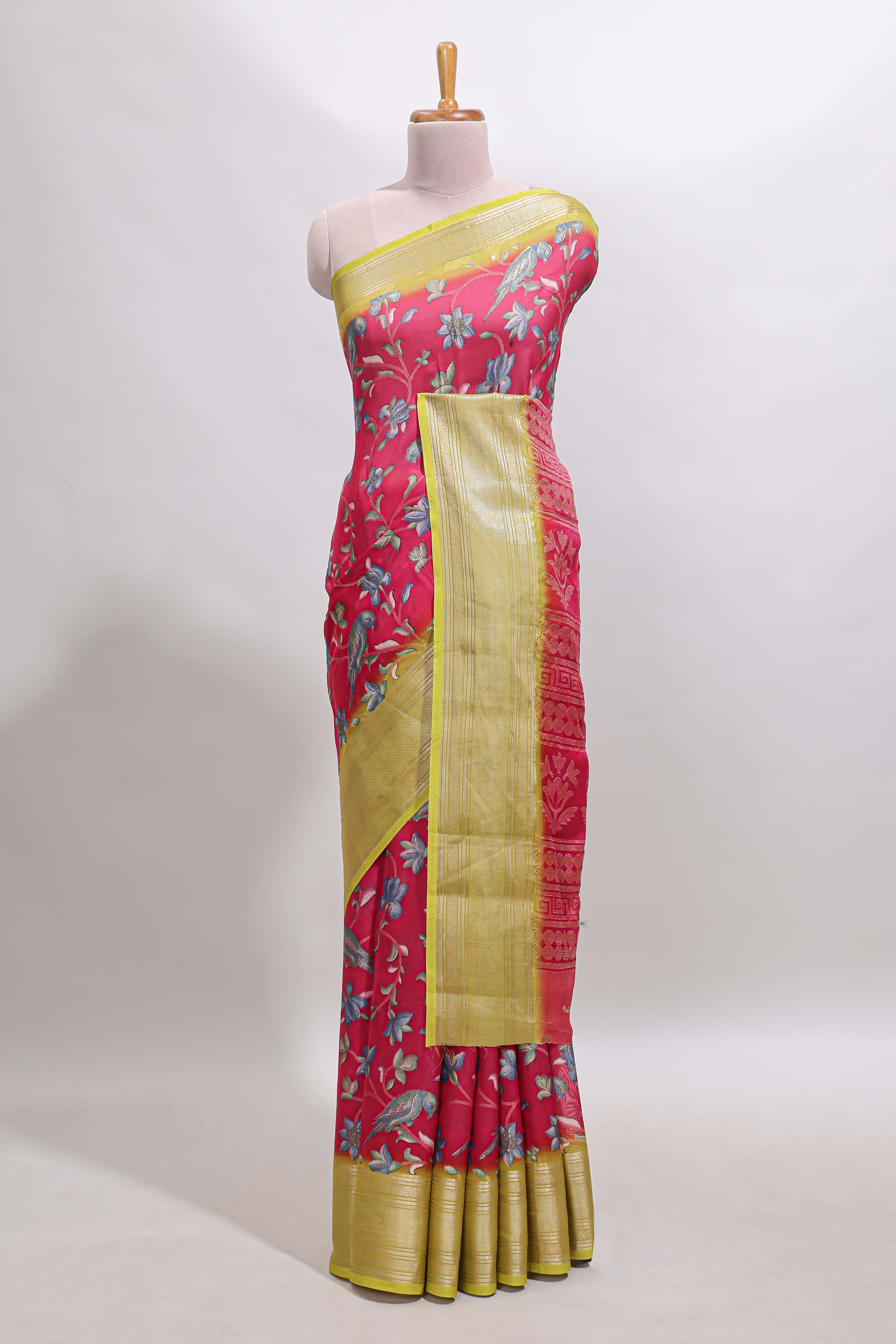 Pink floral design georgette saree with contrast border and motifs blouse