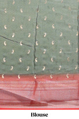 Green floral design georgette saree with contrast border and motifs blouse
