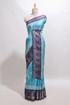 Blue floral design georgette saree with contrast border and motifs blouse