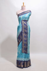Blue floral design georgette saree with contrast border and motifs blouse