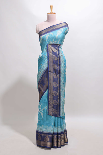 Blue floral design georgette saree with contrast border and motifs blouse