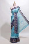 Blue floral design georgette saree with contrast border and motifs blouse