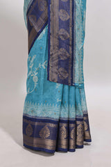 Blue floral design georgette saree with contrast border and motifs blouse