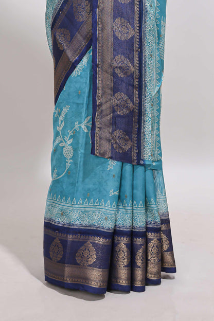 Blue floral design georgette saree with contrast border and motifs blouse