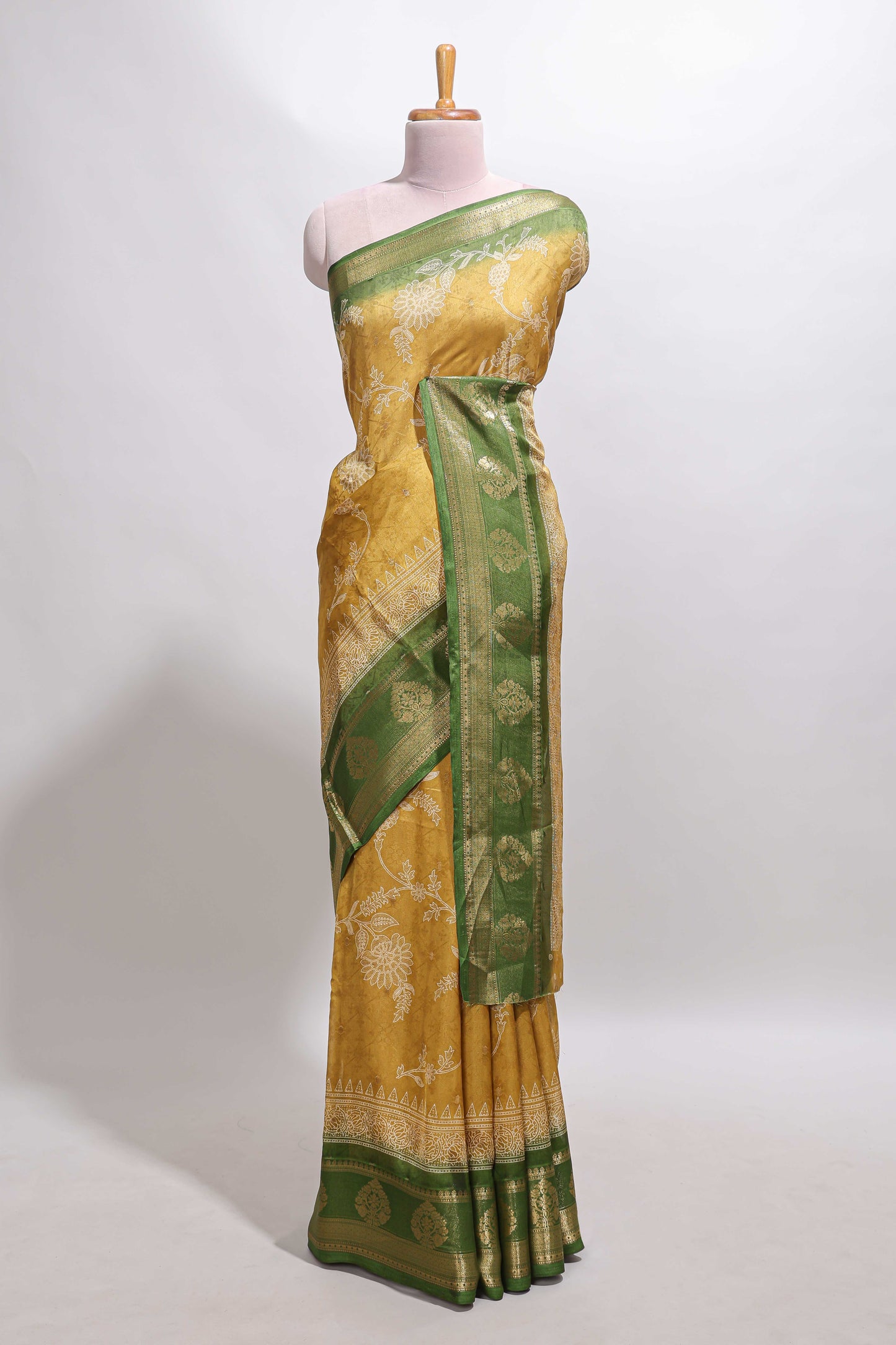 Golden yellow floral design georgette saree with contrast border and motifs blouse