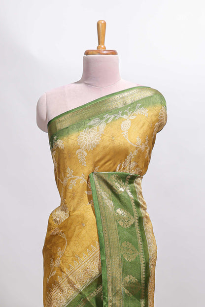 Golden yellow floral design georgette saree with contrast border and motifs blouse