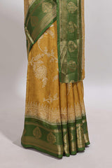 Golden yellow floral design georgette saree with contrast border and motifs blouse