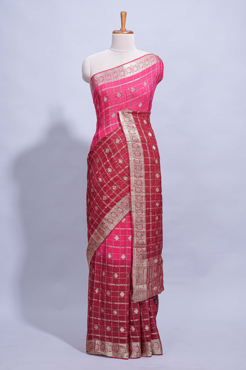 Rani pink double shaded zari checks georgette saree with small zari border and self pallu along with matching zari buttas blouse piece