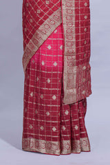 Rani pink double shaded zari checks georgette saree with small zari border and self pallu along with matching zari buttas blouse piece