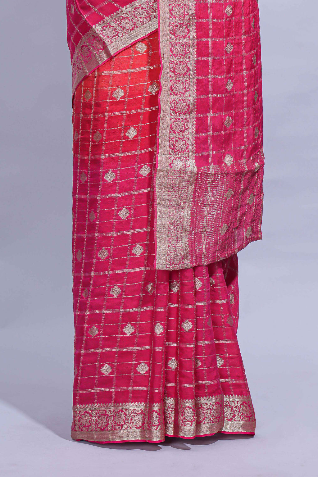Rani Pink and orange double shaded zari checks georgette saree with small zari border and self pallu along with matching zari buttas blouse piece