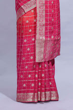 Rani Pink and orange double shaded zari checks georgette saree with small zari border and self pallu along with matching zari buttas blouse piece