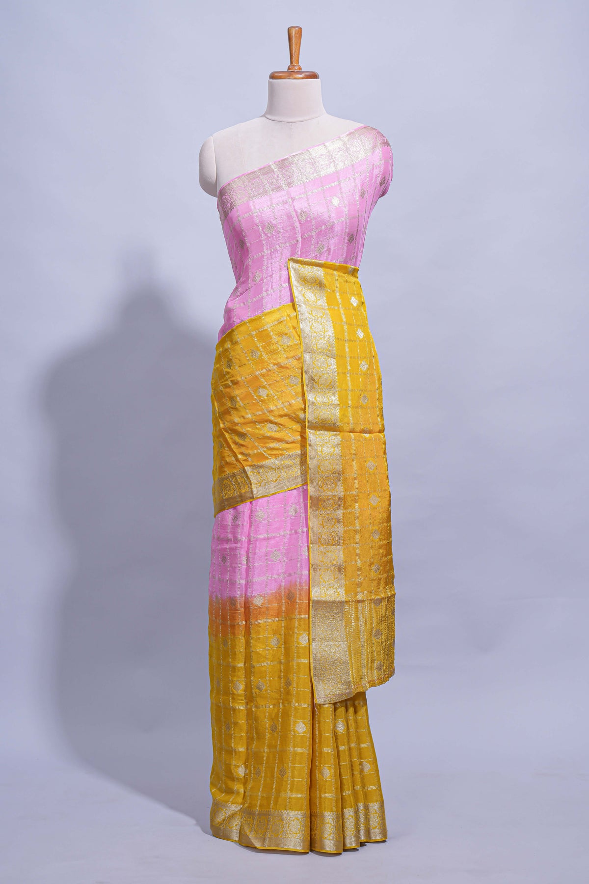 Mustard yellow and pink double shaded zari checks georgette saree with small zari border and self pallu along with matching zari buttas blouse piece