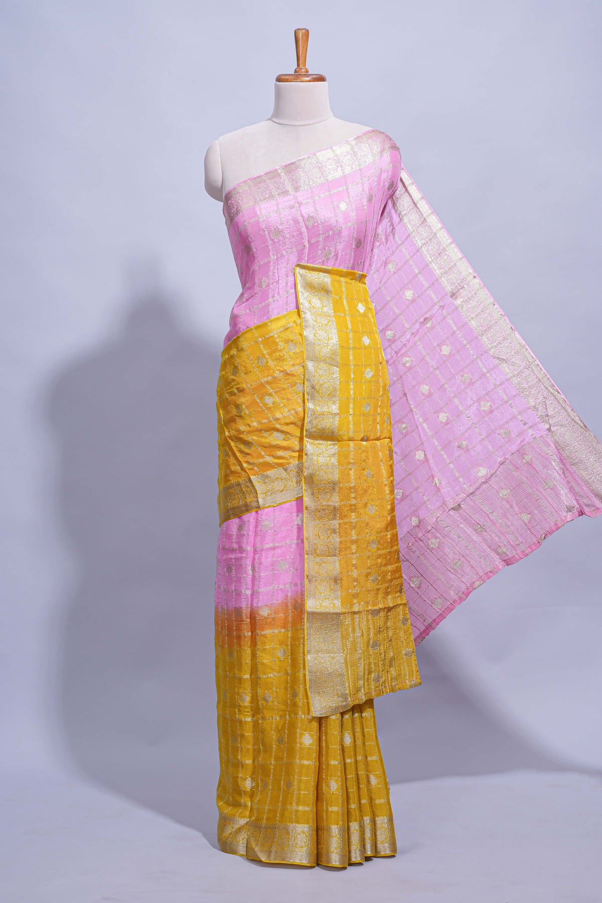 Mustard yellow and pink double shaded zari checks georgette saree with small zari border and self pallu along with matching zari buttas blouse piece
