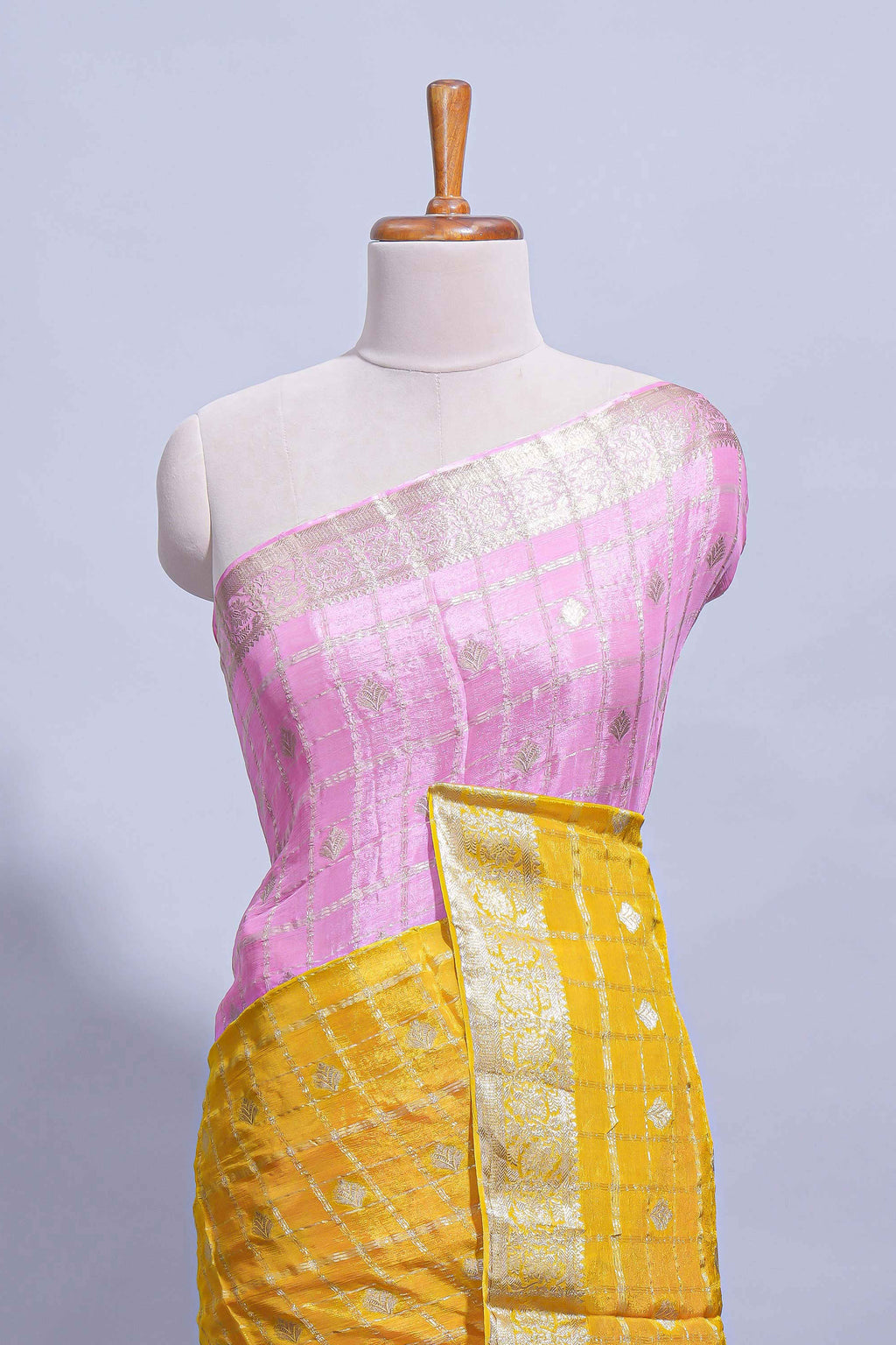 Mustard yellow and pink double shaded zari checks georgette saree with small zari border and self pallu along with matching zari buttas blouse piece