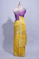 Yellow and violet double shaded zari checks georgette saree with small zari border and self pallu along with matching zari buttas blouse piece