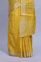 Yellow and violet double shaded zari checks georgette saree with small zari border and self pallu along with matching zari buttas blouse piece