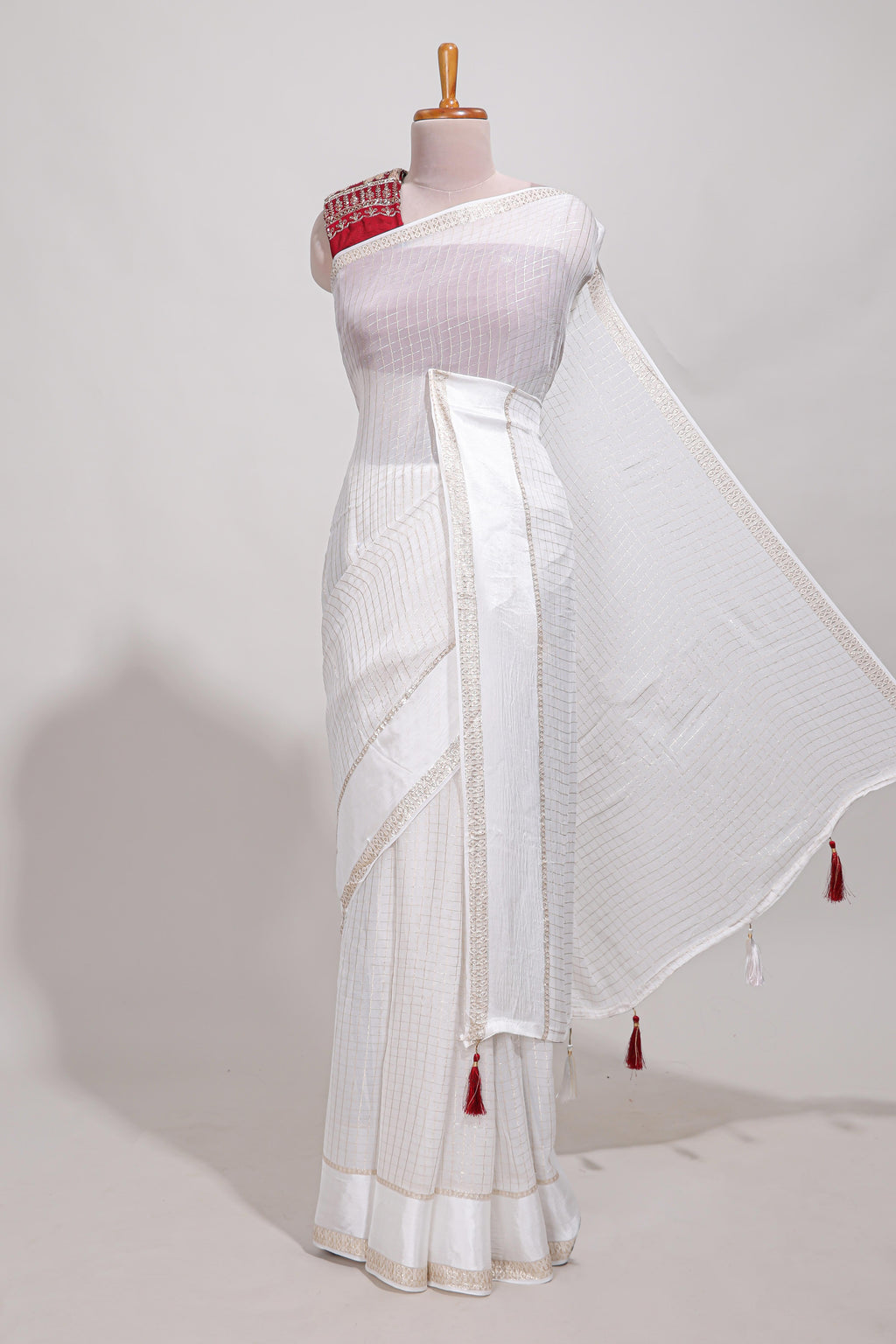 White checks georgette saree with small zari border and contrast aari work blouse