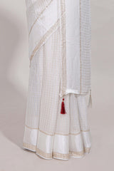 White zari checks georgette saree with small zari border and contrast aari work blouse