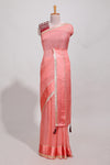 Peach zari checks georgette saree with small zari border and contrast aari work blouse