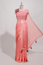 Peach zari checks georgette saree with small zari border and contrast aari work blouse