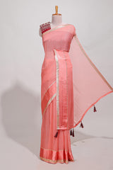 Peach zari checks georgette saree with small zari border and contrast aari work blouse