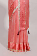Peach zari checks georgette saree with small zari border and contrast aari work blouse