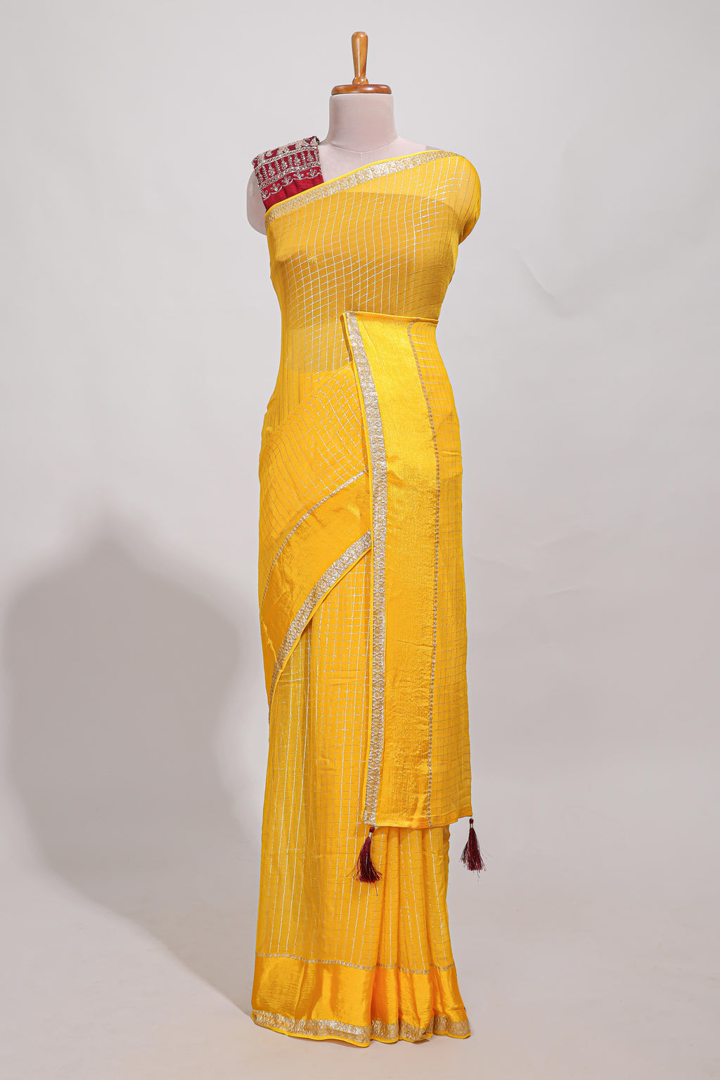 Peach  checks georgette saree with small  border and contrast aari work blouse