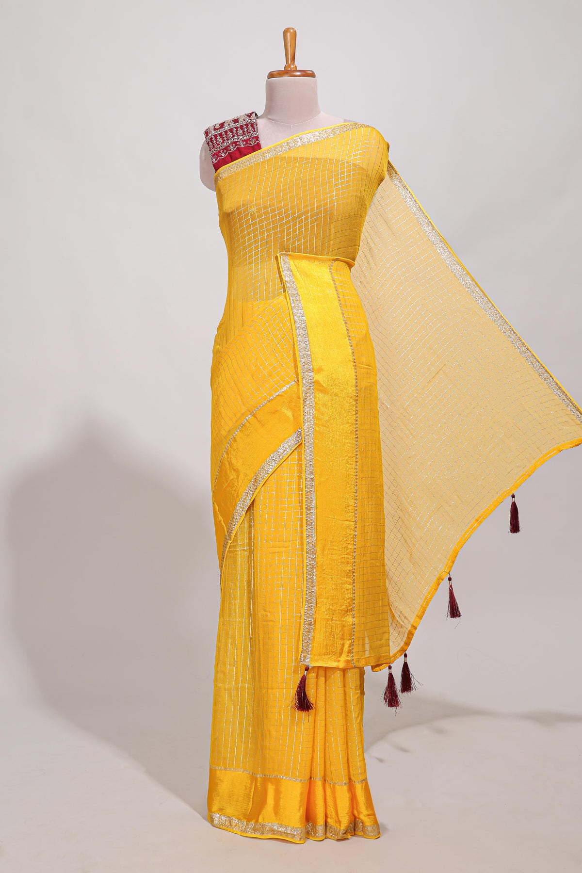 Peach  checks georgette saree with small  border and contrast aari work blouse