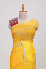 Peach zari checks georgette saree with small zari border and contrast aari work blouse