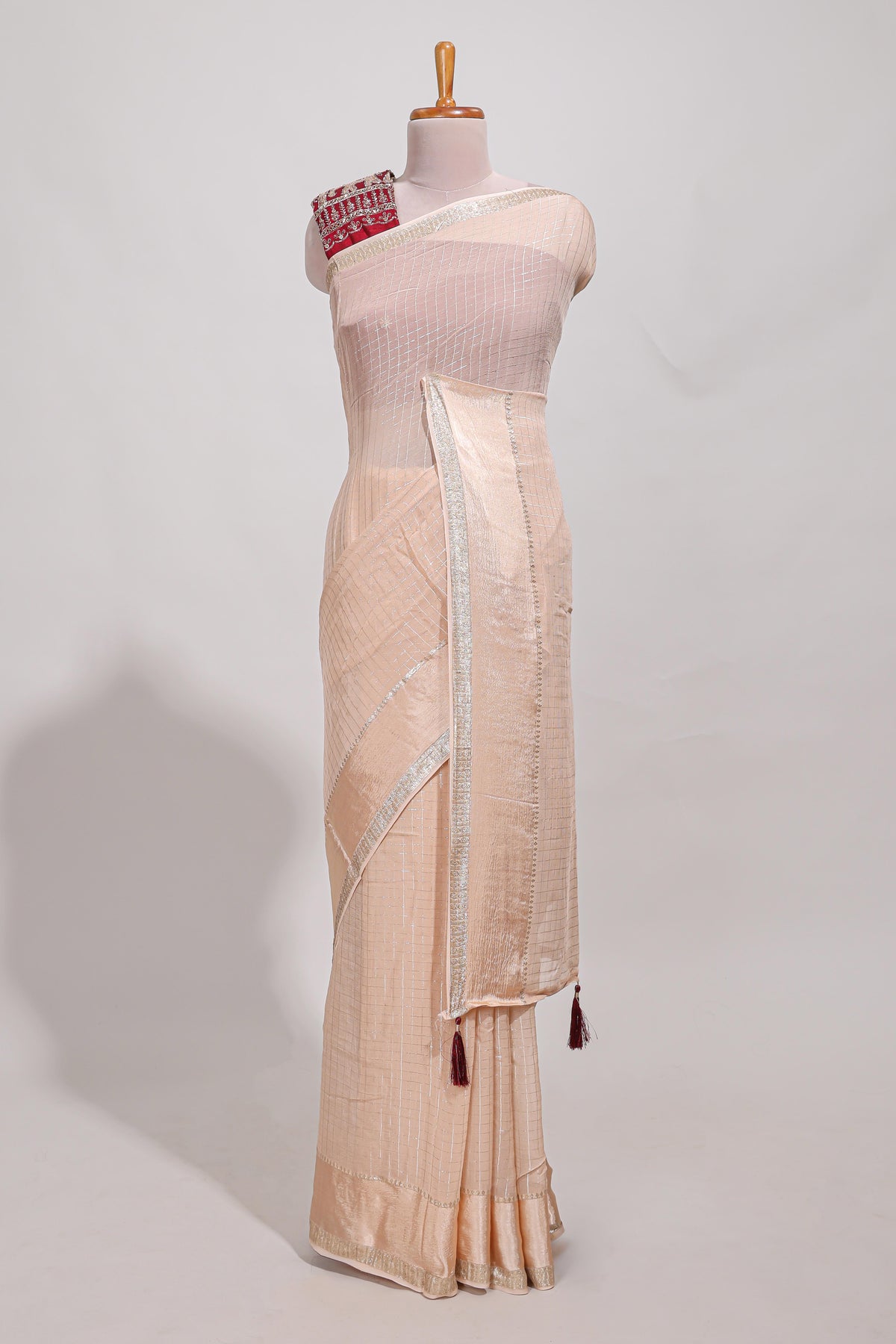 Cream zari checks georgette saree with small zari border and contrast aari work blouse