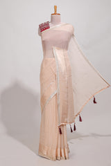 Cream zari checks georgette saree with small zari border and contrast aari work blouse