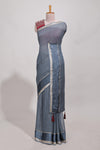 Gray zari checks georgette saree with small zari border and contrast aari work blouse
