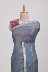 Gray zari checks georgette saree with small zari border and contrast aari work blouse