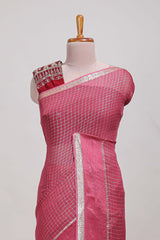 Magenta zari checks georgette saree with small zari border and contrast aari work blouse