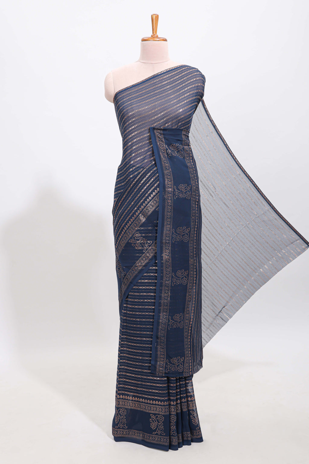 Blue vertical zari design georgette saree with self floral design border and matching blouse