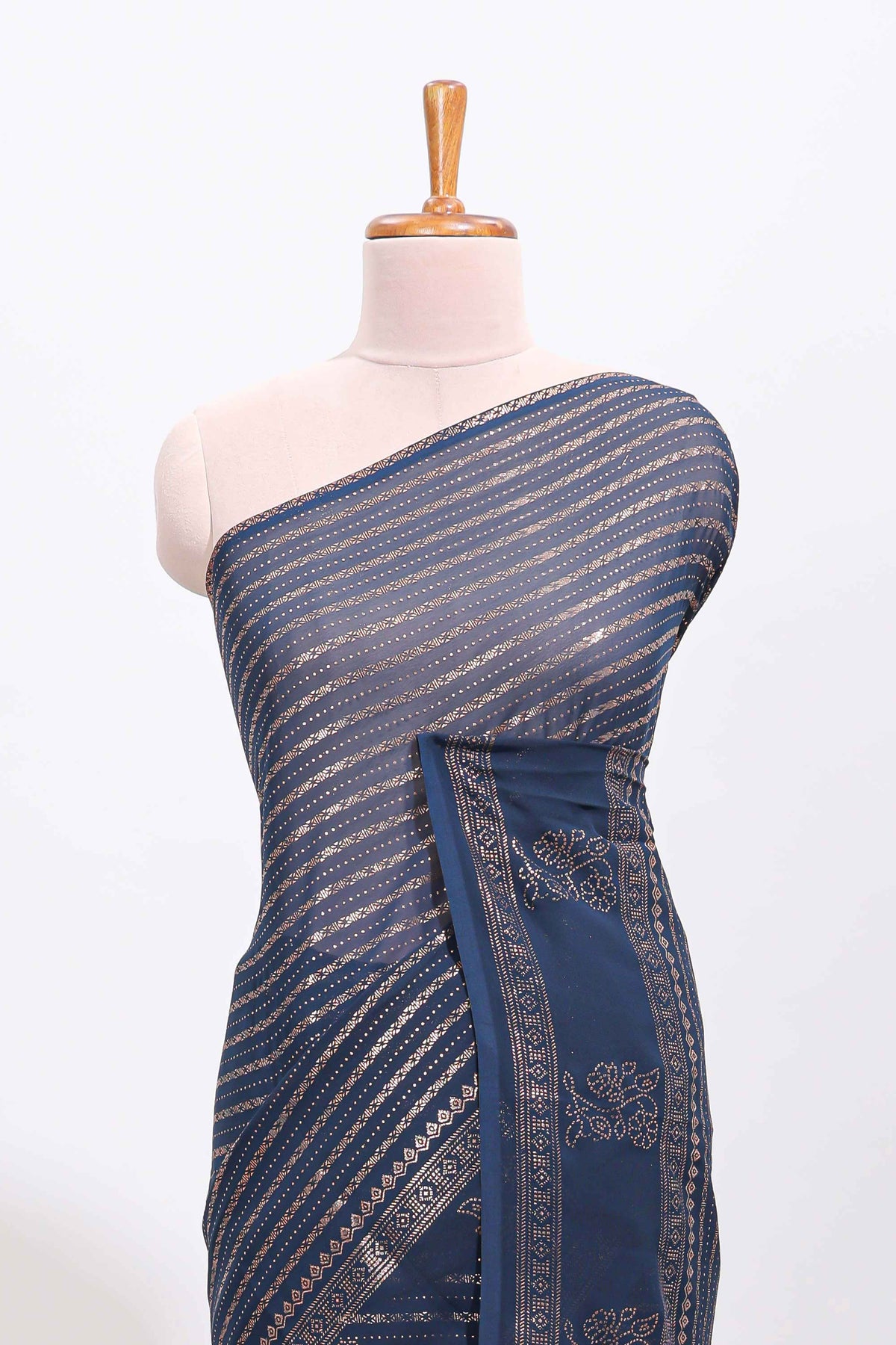 Blue vertical zari design georgette saree with self floral design border and matching blouse